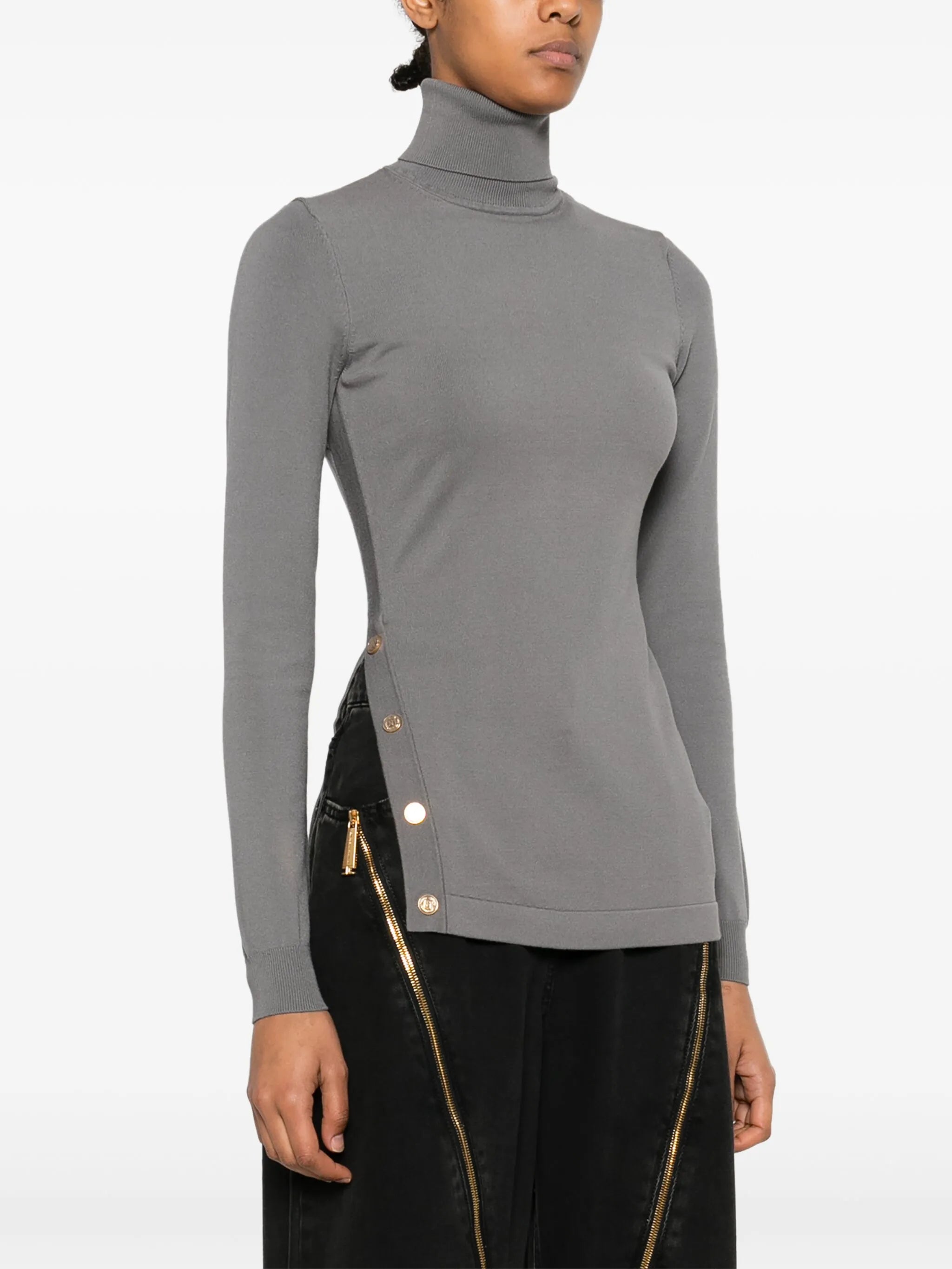 Sweater with decorative buttons