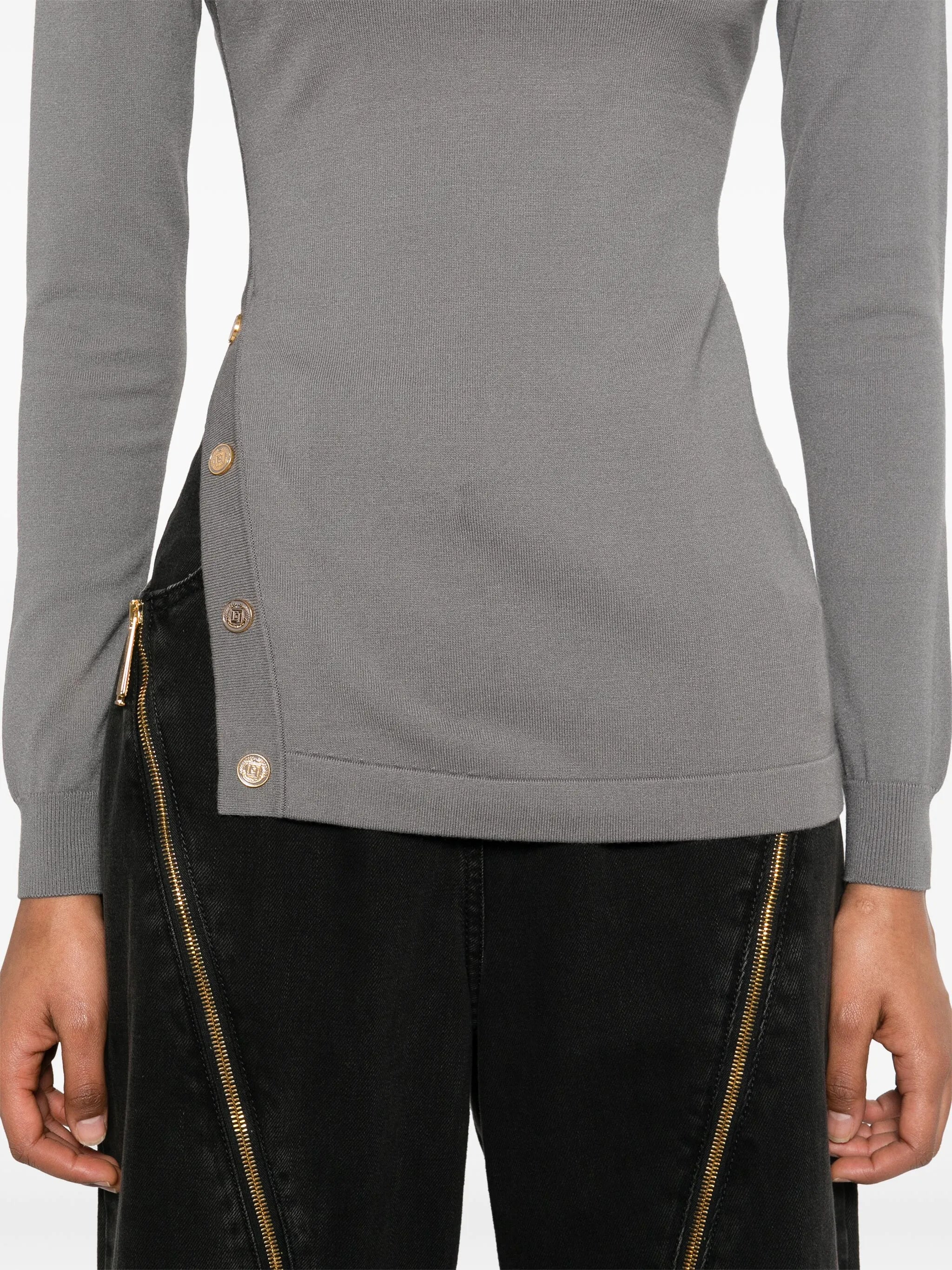 Sweater with decorative buttons
